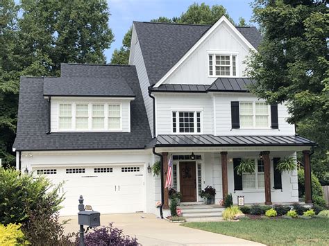 white house with dark grey metal roof|white house black roof pictures.